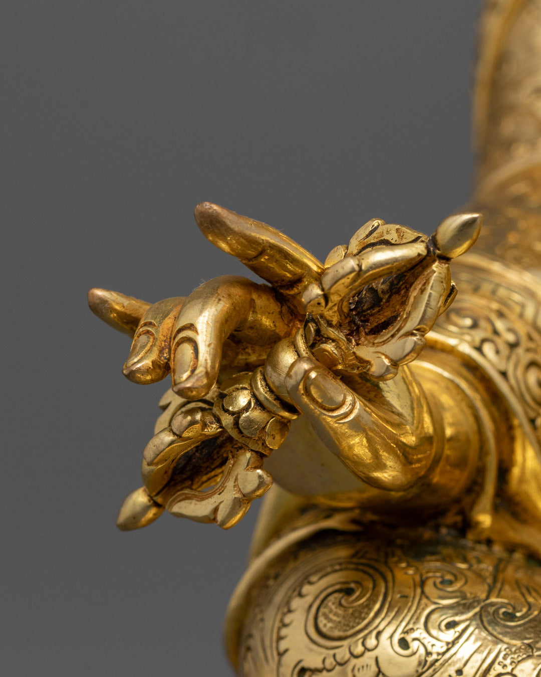 Guru Rinpoche Padmasambhava statue | Tibetan Buddhist figure | lotus-born master, Vajrayana guru, tantric meditation teacher, holding vajra and kapala, seated on lotus throne, rich traditional attire, Himalayan Buddhist icon.