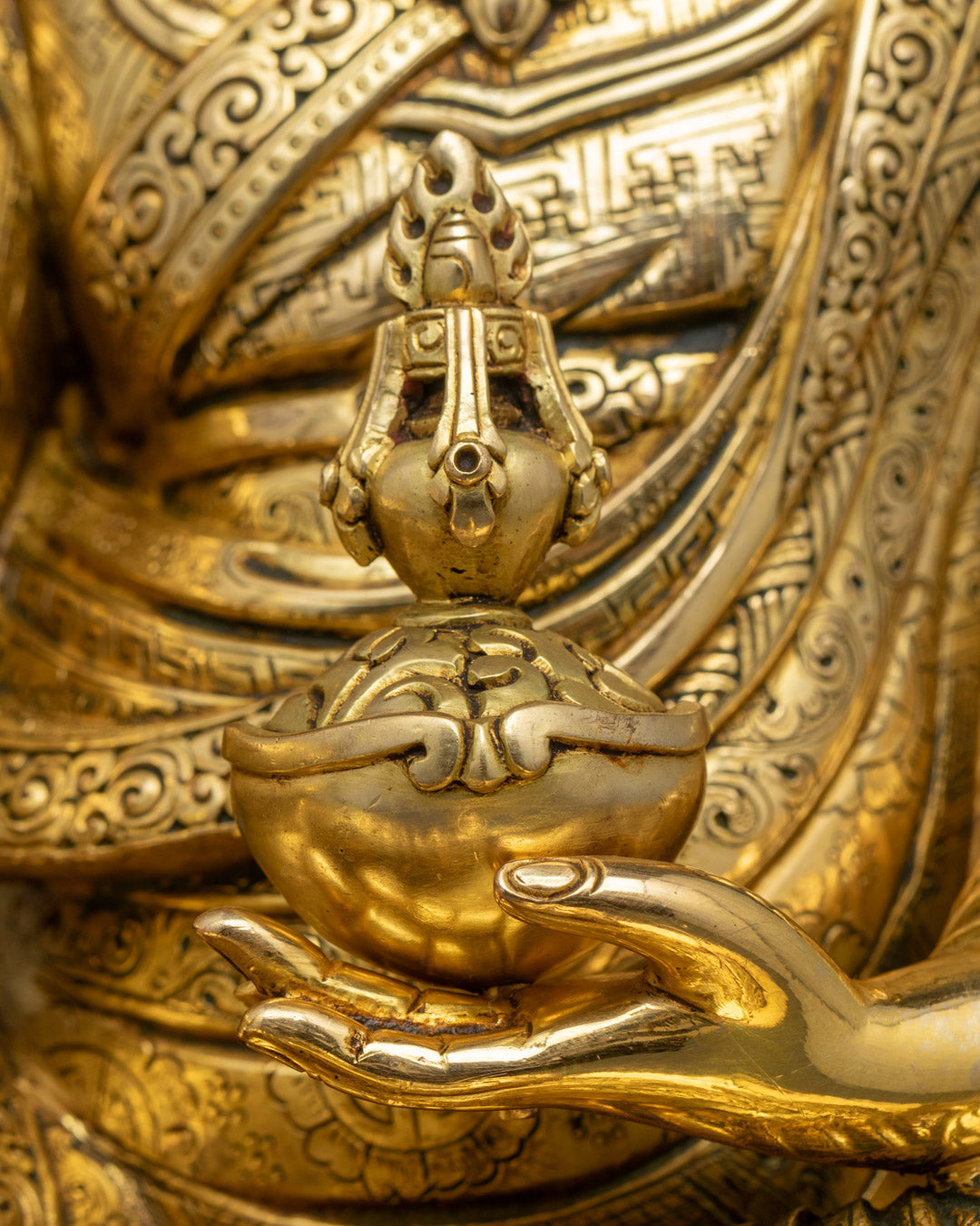 Guru Rinpoche Padmasambhava statue | Tibetan Buddhist figure | lotus-born master, Vajrayana guru, tantric meditation teacher, holding vajra and kapala, seated on lotus throne, rich traditional attire, Himalayan Buddhist icon.