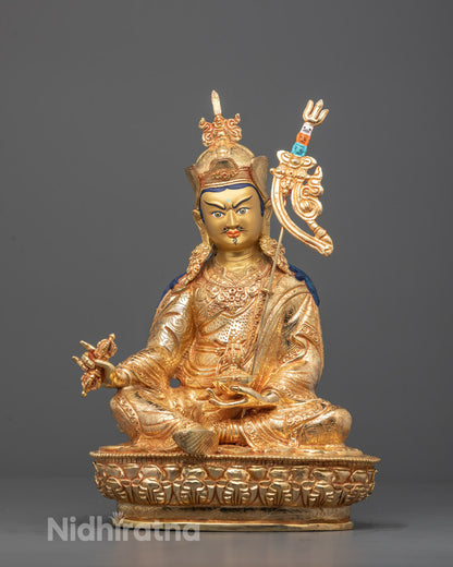 Front view of Padmasambhava statue with 24K gold-gilded face and intricate carvings