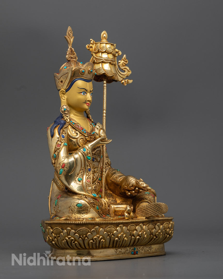 Guru Norla statue showing intricate robe patterns, sacred ornaments, and spiritual iconography