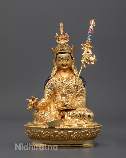 Guru Padmasambhava Sculpture front view with gold-gilded face and robe carvings