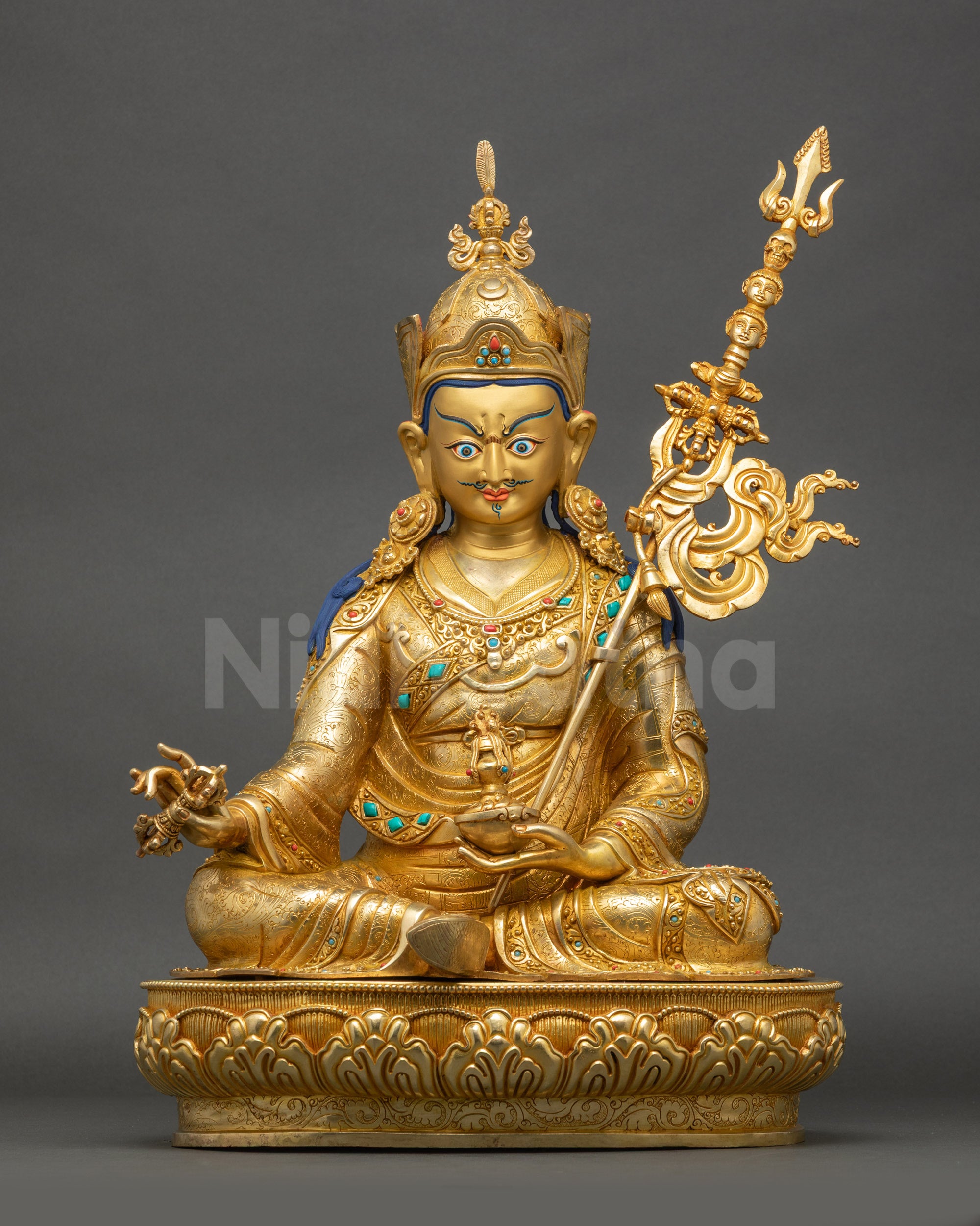 Front view of Guru Padmasambhava Statue with gold fire-gilded base and intricate carvings