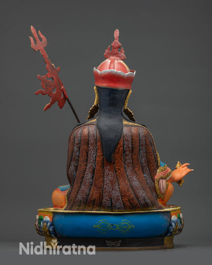 Guru Padmasambhava Statue back view with detailed carvings and painted garments