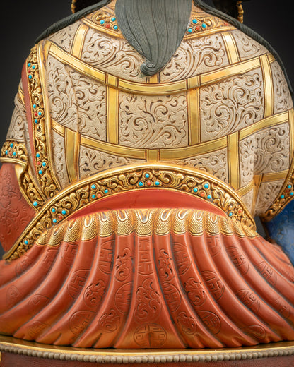 Close-up of Guru Rinpoche robe from back, showing Tirpatika patterns and gold-accented design.