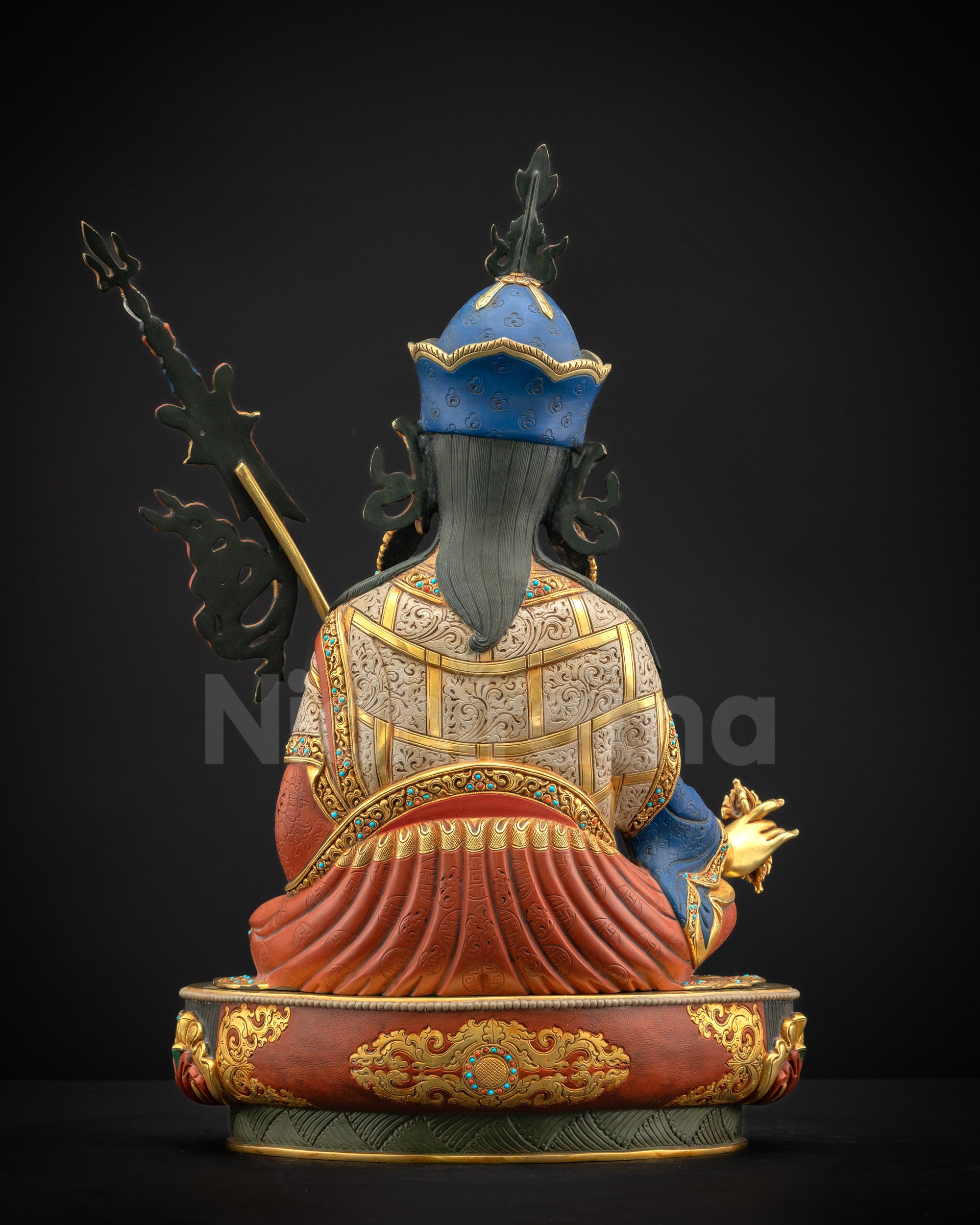 Back view of Guru Rinpoche statue, showing Tirpatika robe, ornaments, and lotus pedestal.