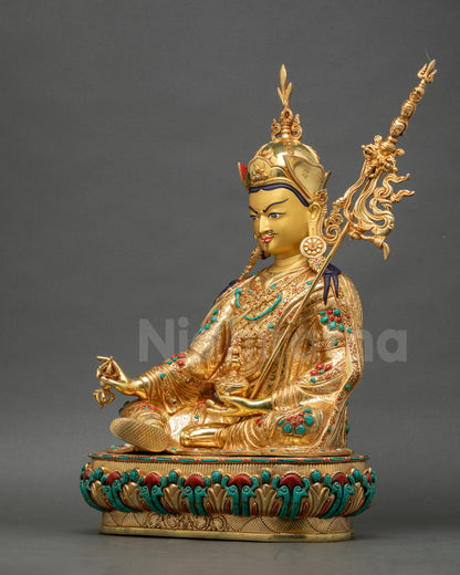 Guru Padmasambhava holding kapala skull cup and dorje Vajrayana Buddhist copper statue