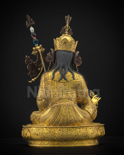 Back view of Guru Rinpoche sculpture showcasing finely carved kasaya robes, lotus throne base, and exquisite Himalayan craftsmanship