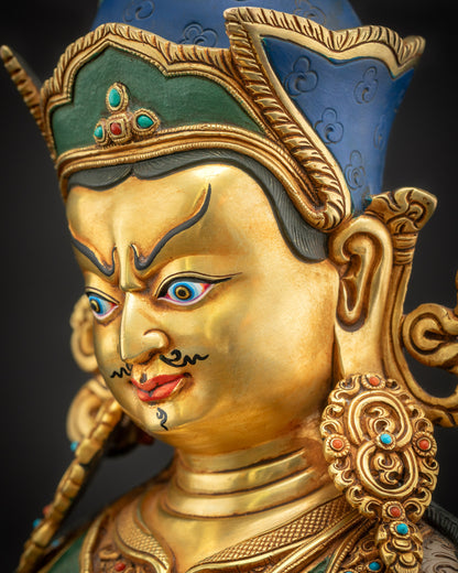 Side close-up of Guru Rinpoche face, highlighting hand-carved features and gold accents.