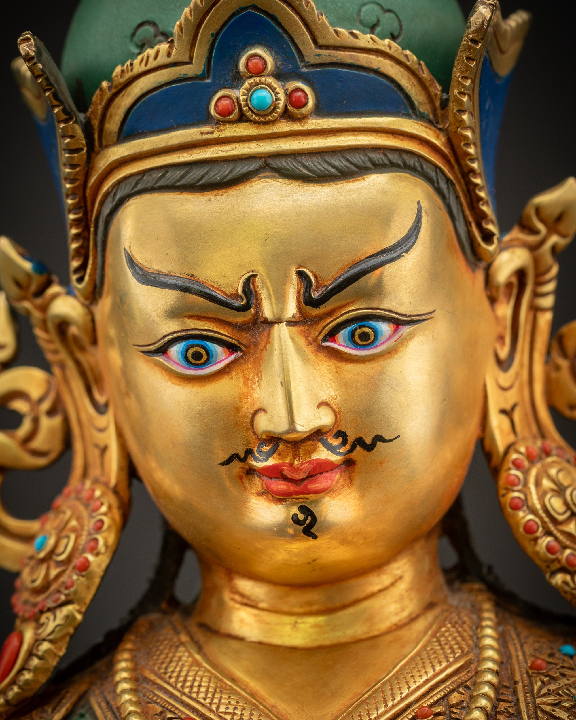 Detailed close-up of Guru Rinpoche Padmasambhava face with semi-wrathful expression and lotus crown for spiritual focus