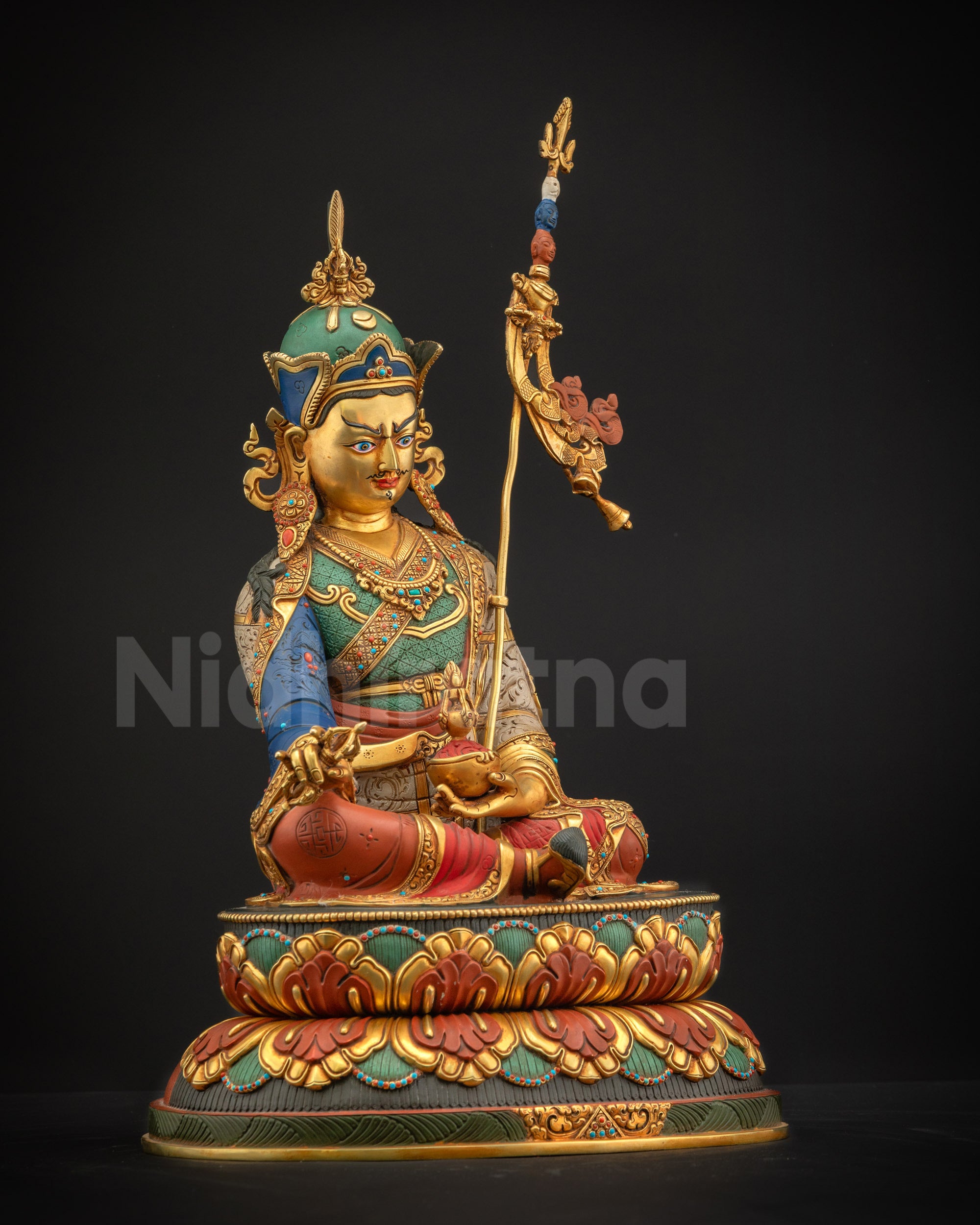 Right-side view of copper-gilded Guru Rinpoche statue holding Vajra and Kapala for spiritual altar centerpiece
