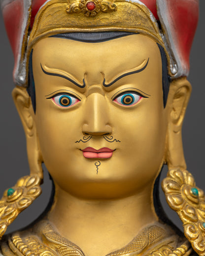 Guru Rinpoche Statue detailed close up face with semi-wrathful gold-gilded facial expression