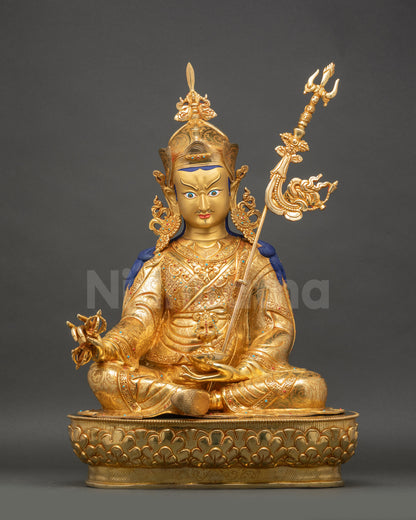 Guru Rinpoche Statue full front view showing gold-painted face and fire-gilded copper details