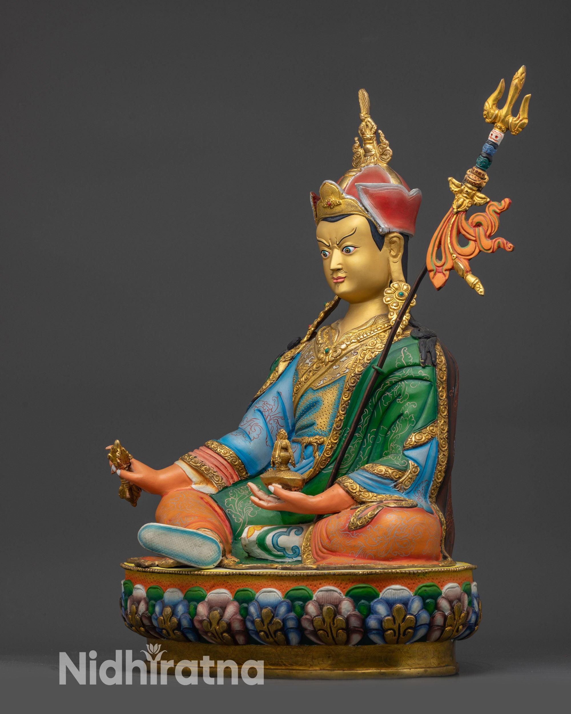 Guru Rinpoche Statue left side view showing kasaya robes and intricate carving