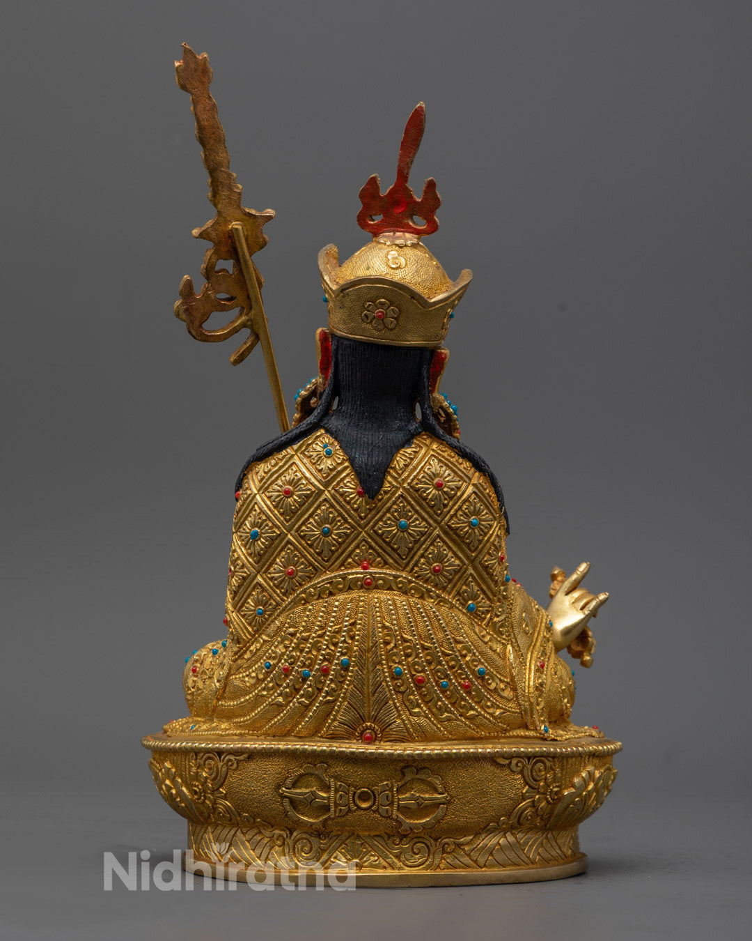 Guru Rinpoche Statue showcasing vibrant acrylic colors, gold-gilded features, and exceptional Himalayan craftsmanship.