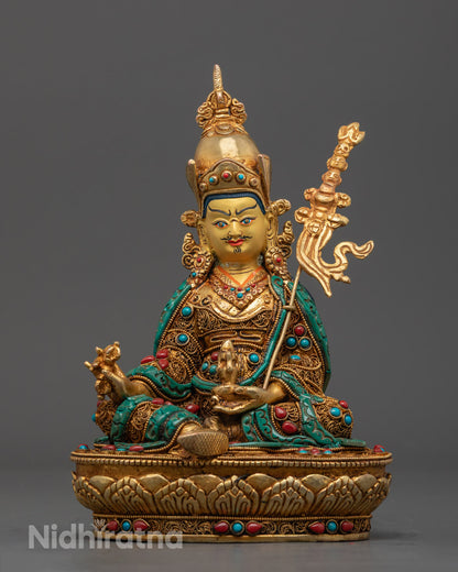 Hand-carved Guru Rinpoche Statue with 24k gold fire gilding and semi-precious stones, crafted using traditional Nepalese lost wax method.