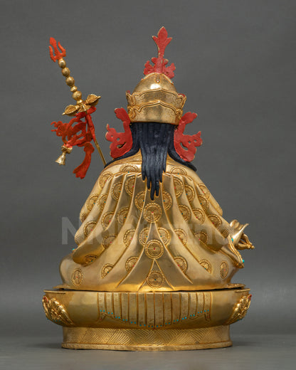 Guru Rinpoche statue back view showing detailed carvings and polished finish