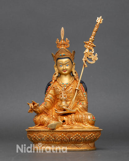 Guru Rinpoche statue seated in royal ease, handcrafted Nepalese copper with 24K gold