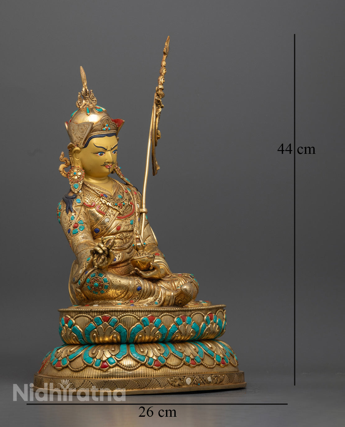 Guru Rinpoche statue showing the detailed robe patterns and the vajra held in hand, handcrafted using the lost wax method.