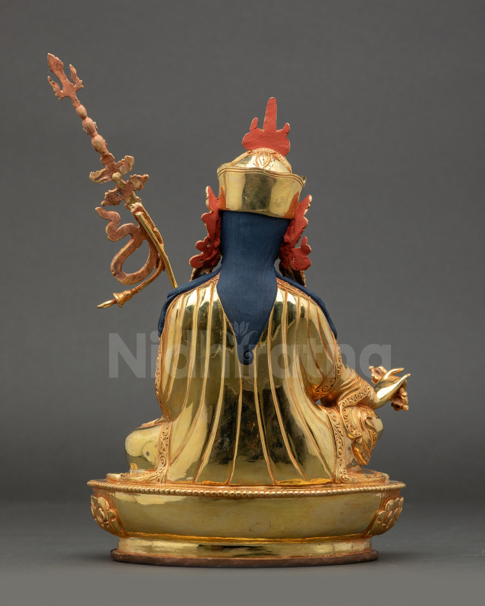 Guru Rinpoche statue, trident detail, lost-wax cast copper, Himalayan Buddhist art
