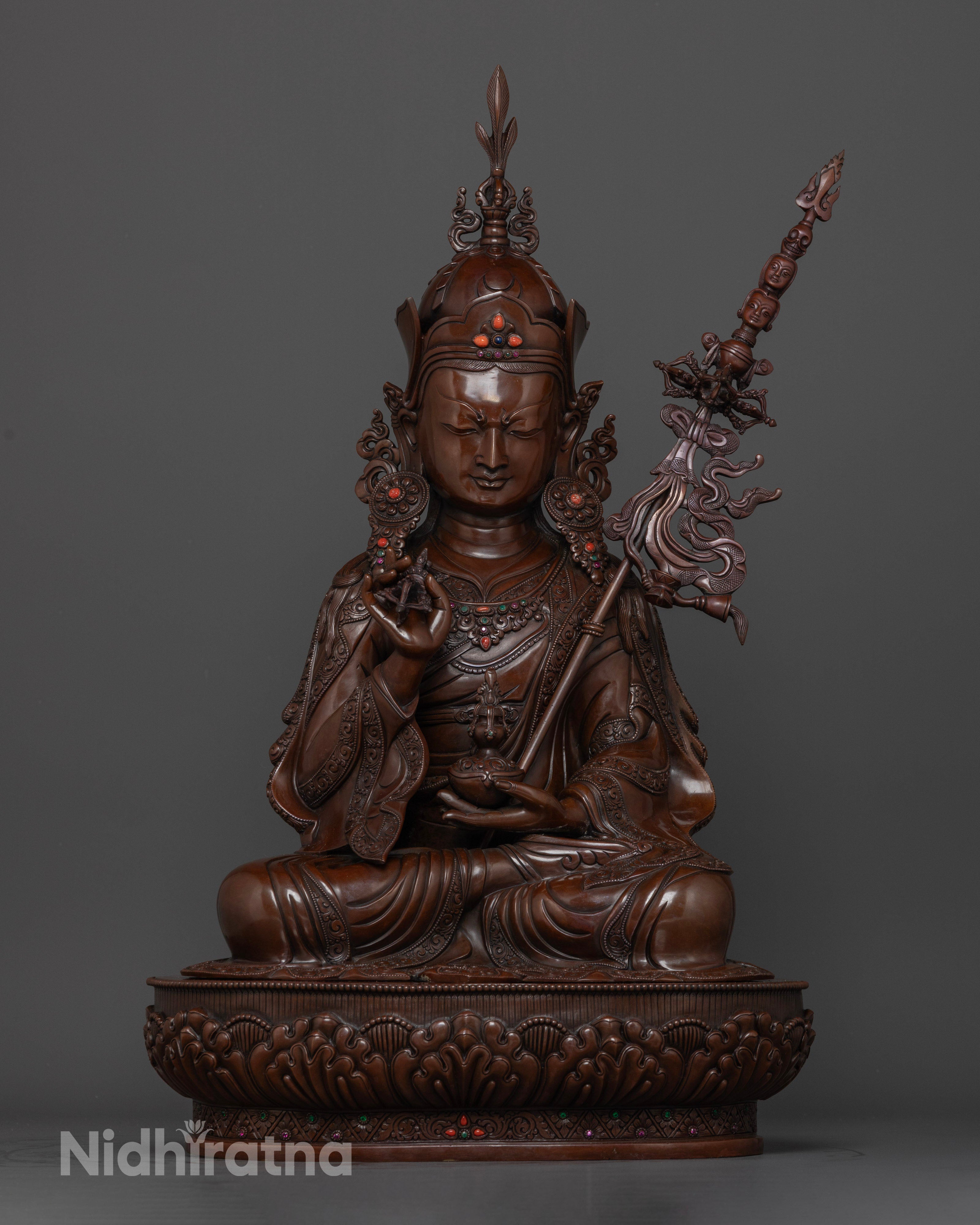 Front-view of Hand-carved Guru Rinpoche statue with 24k gold gilded face seated on lotus throne