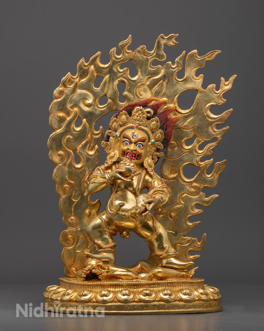 Hand-carved Black Dzambhala statue in deep ebony, showcasing 24k fire-gilded copper accents and vibrant multi-acrylic coloring.