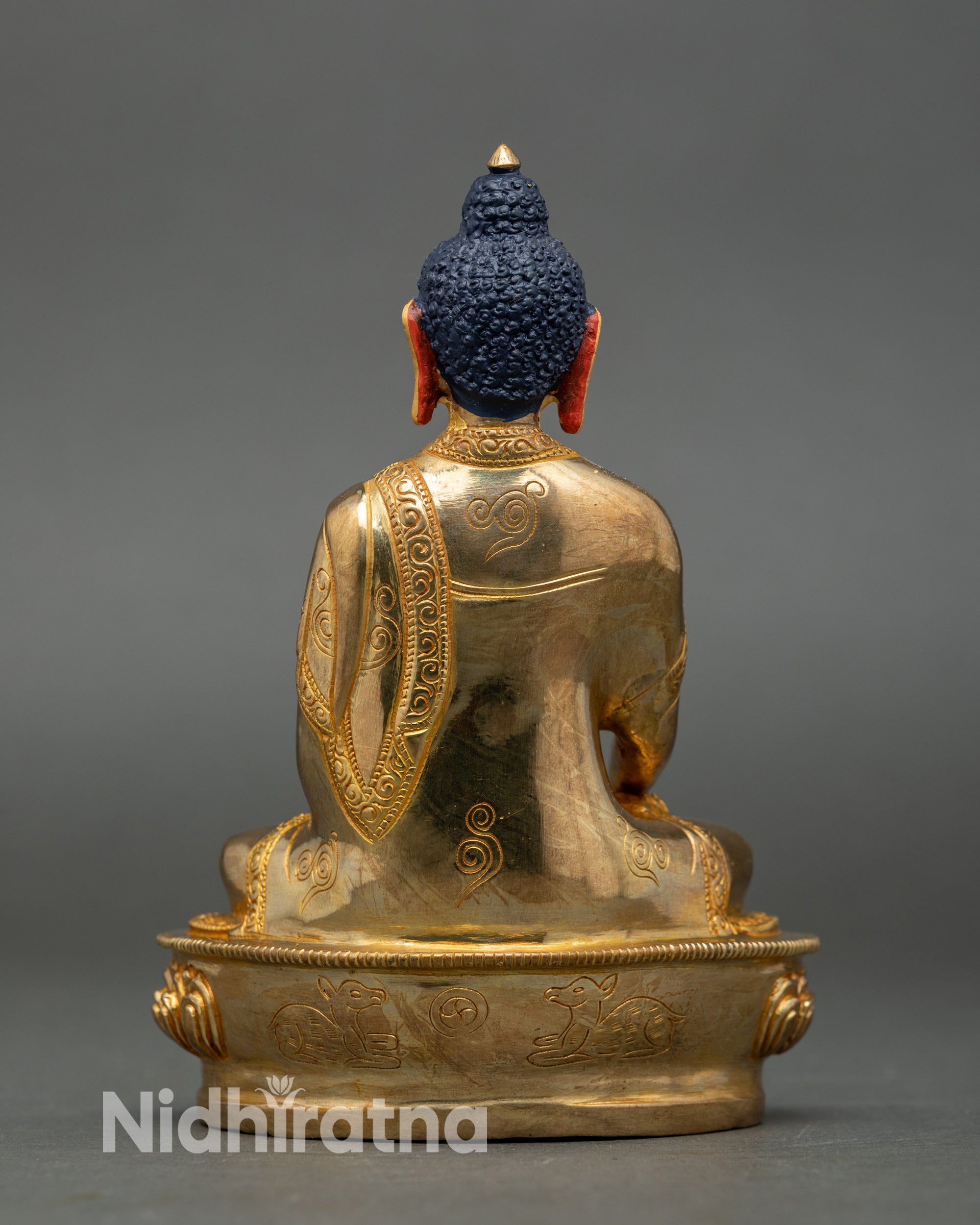 Hand-carved Buddha figurine in lotus seat, symbolizing wisdom and purity