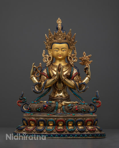 Hand-carved Chenrezig statue adorned with semi-precious stones and 24k gold fire-gilding, crafted by Nepalese artisans using the lost wax method.