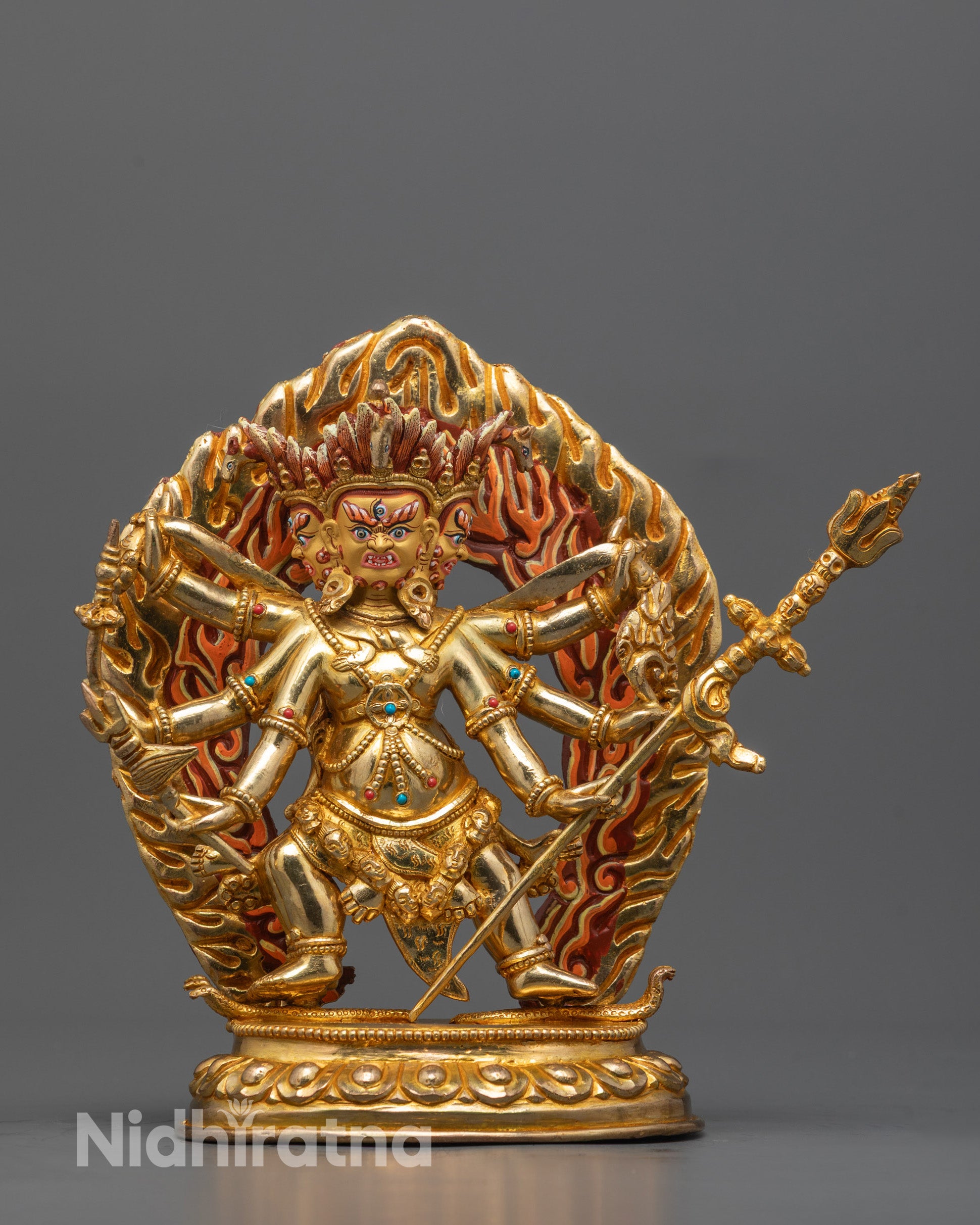 Hand-carved Dharmapala Statue from Nepal with multiple arms holding sacred objects