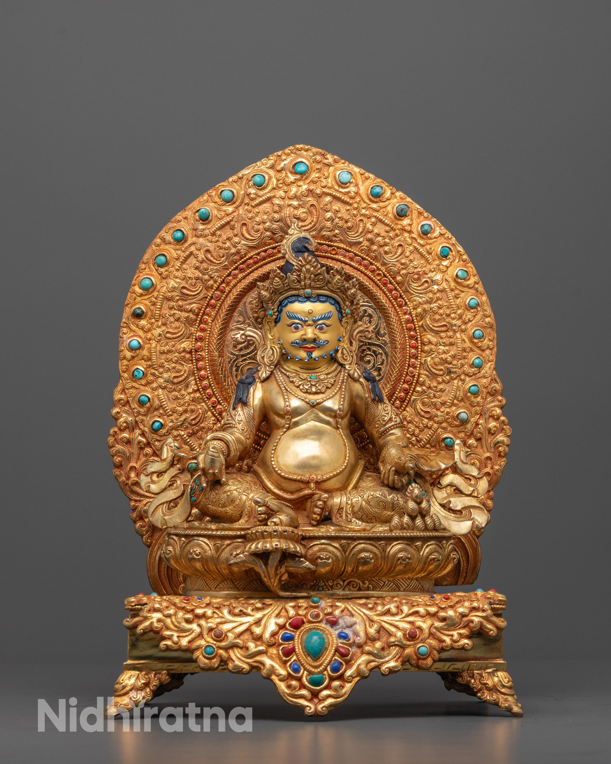 Hand-carved Dzambhala Statue seated on a lotus throne with 24k gold gilded face