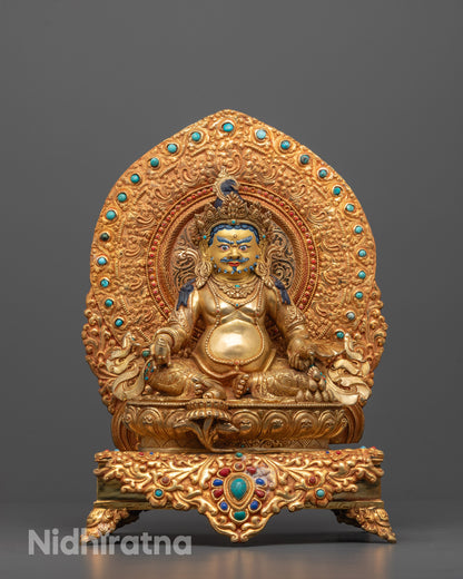 Hand-carved Dzambhala Statue seated on a lotus throne with 24k gold gilded face
