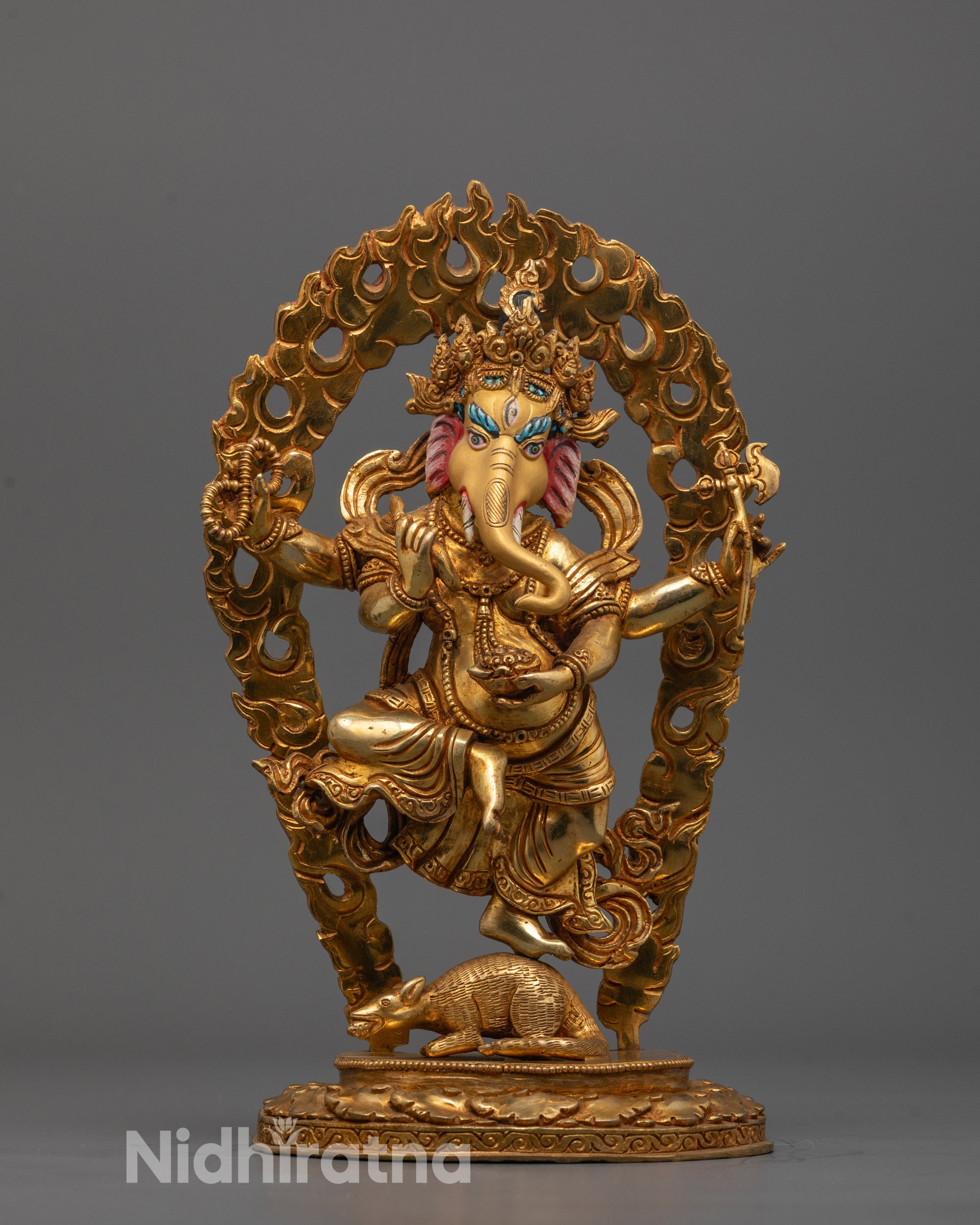 Hand-carved Ganesh Statue from Nepal with 24k gold fire gilding standing on a mouse