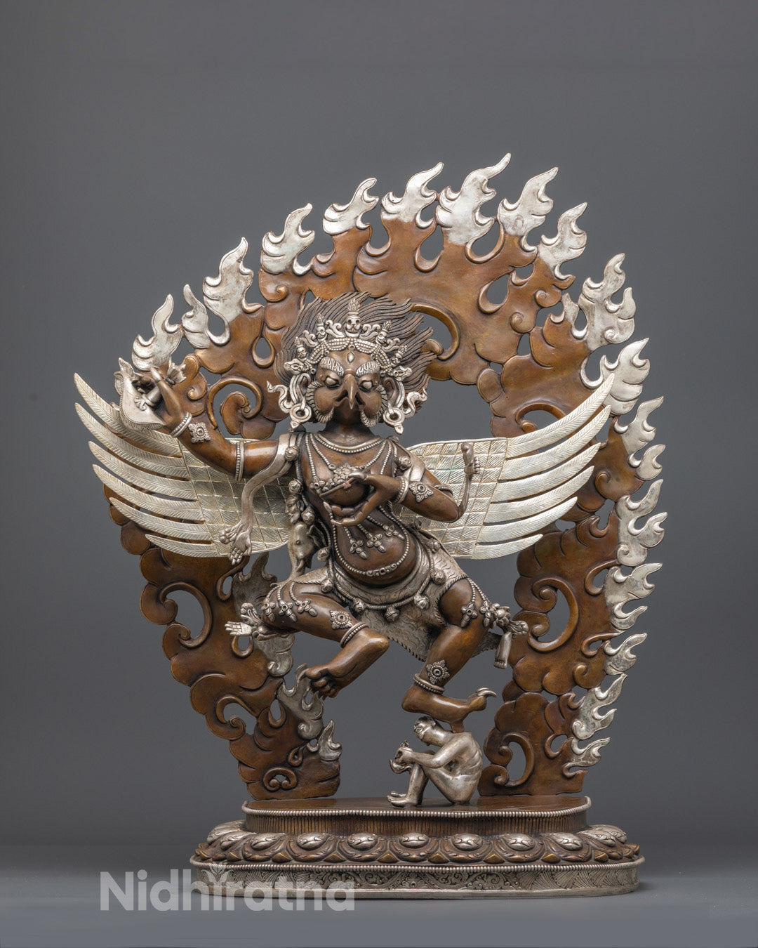 Hand-carved Garuda statue crafted from premium oxidized copper with silver-plated finish, showcasing intricate wing details
