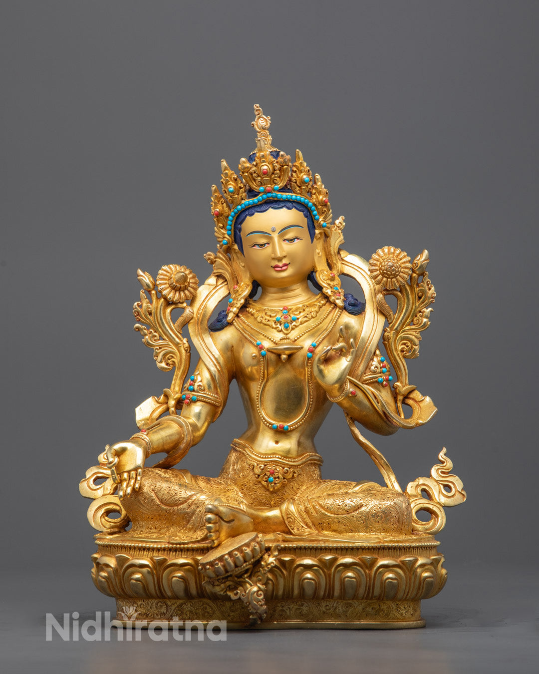 Hand-carved Green Tara Buddha statue with 24k fire-gilded gold and copper base, crafted by Nepali artisan