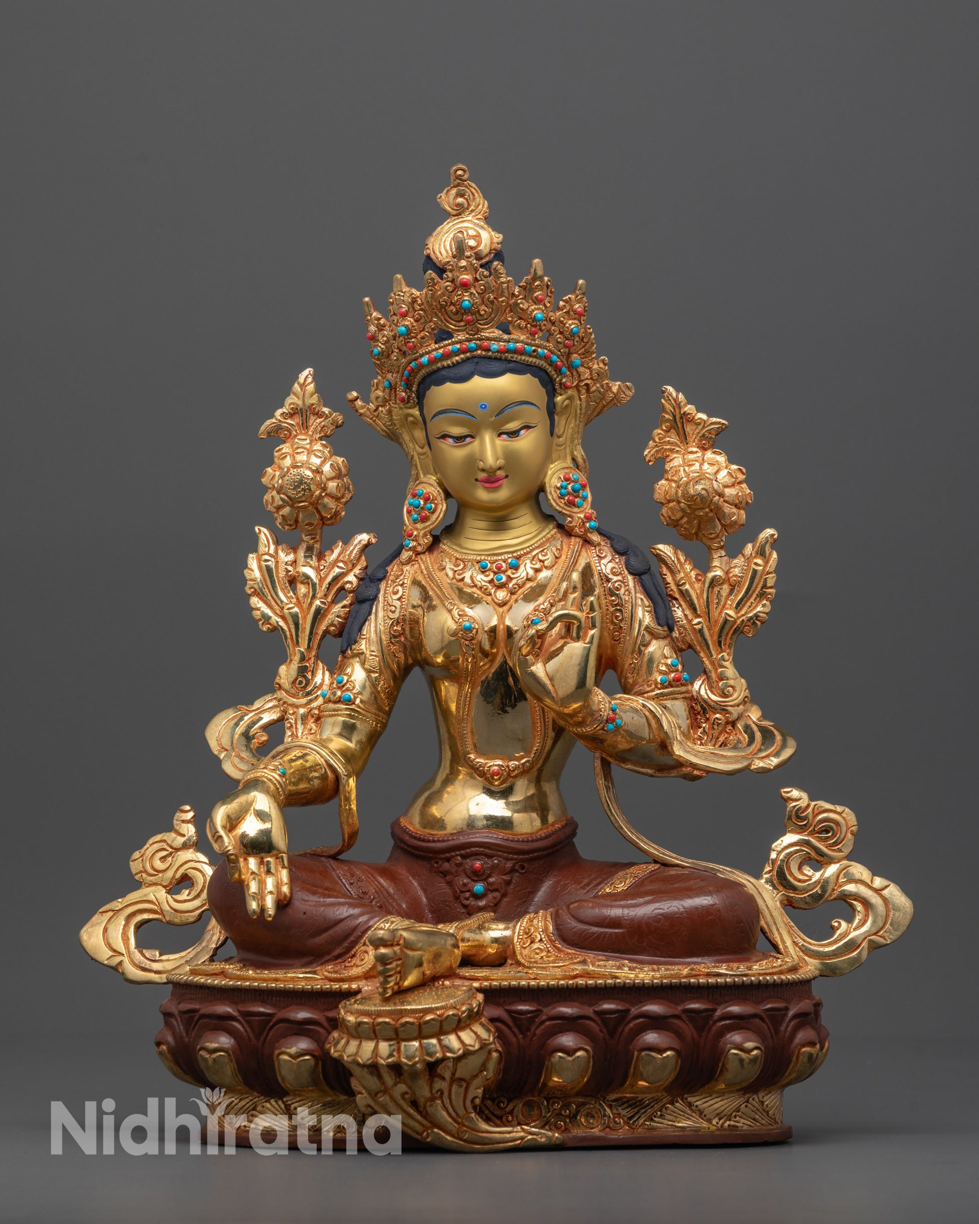 Hand-carved Green Tara Statue seated on lotus with varada mudra made in Nepal
