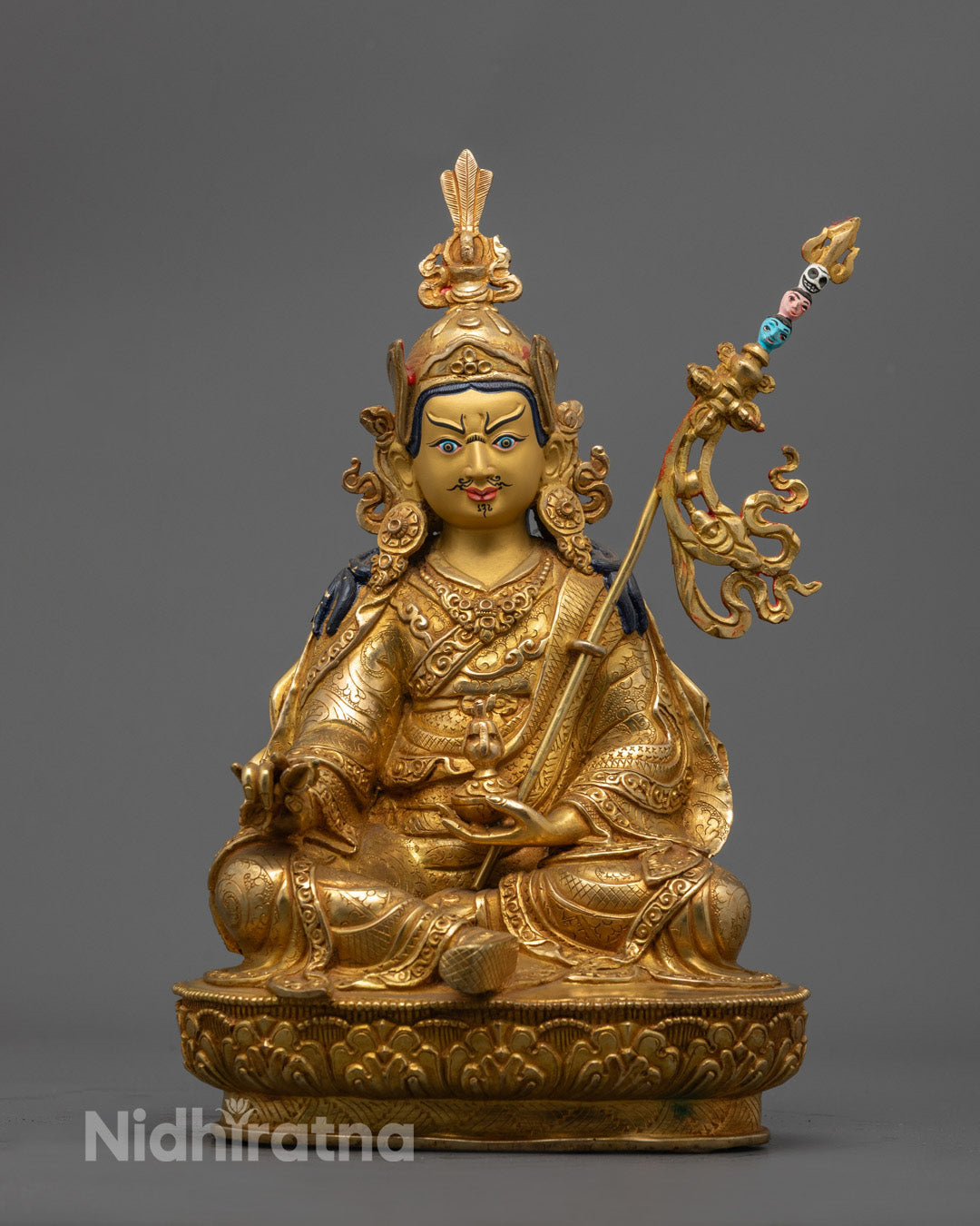 Hand-carved Guru Rinpoche Statue with 24k gold fire gilding and vibrant acrylic colors, crafted in Nepal using the lost wax method.