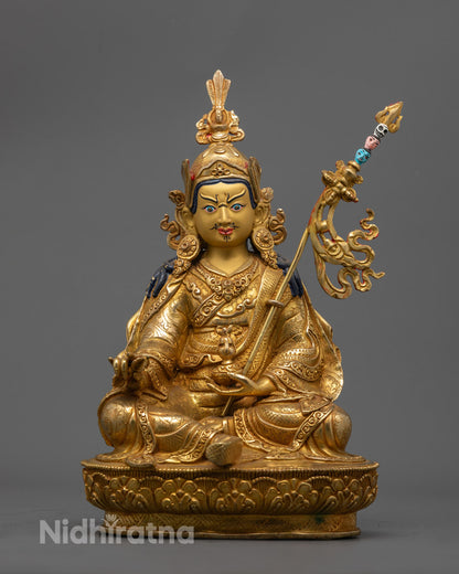 Hand-carved Guru Rinpoche Statue with 24k gold fire gilding and vibrant acrylic colors, crafted in Nepal using the lost wax method.