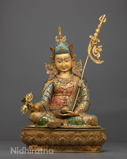 front-view of Hand-carved Guru Rinpoche statue with 24k gold gilded face, seated on a lotus throne