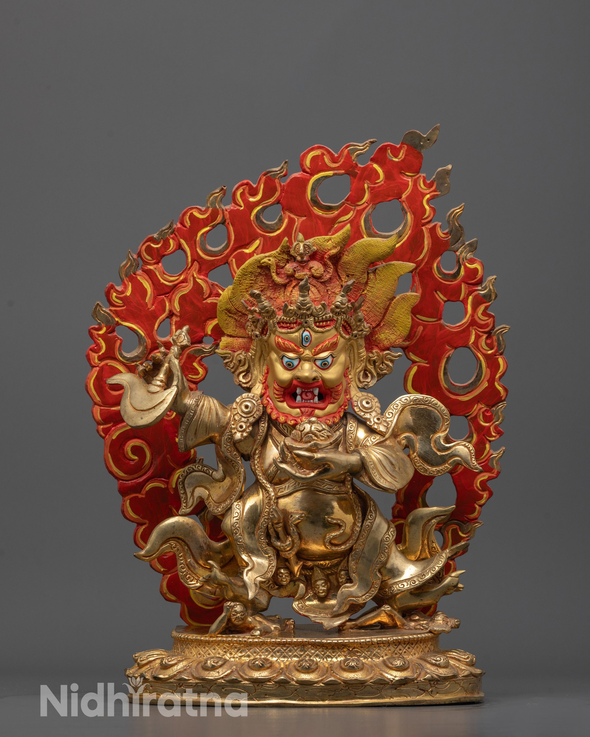Hand-carved Mahakala Bernagchen Statue standing on a subdued figure with fierce expression