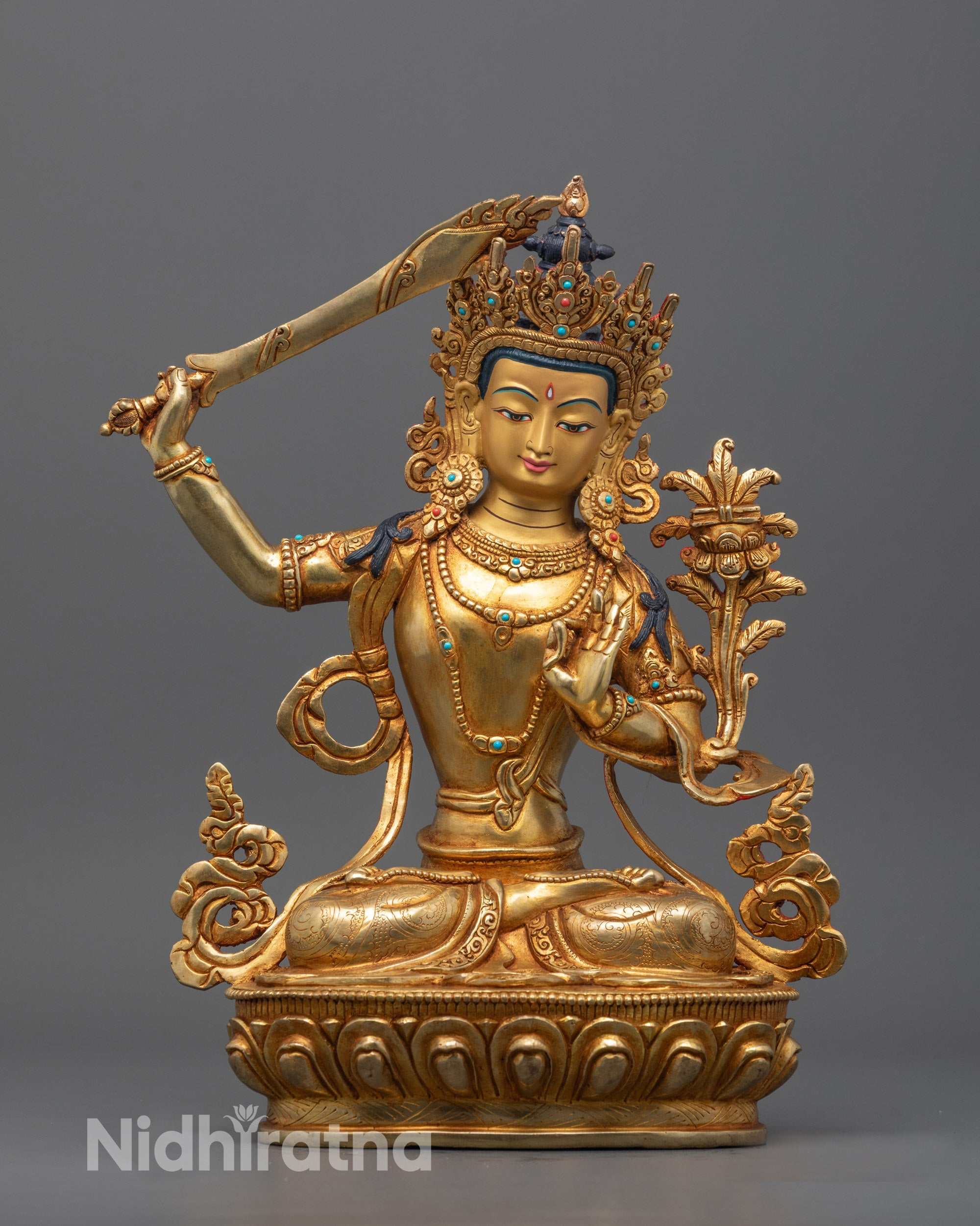 Hand-carved Manjushri statue with halo and sword, seated in meditative posture