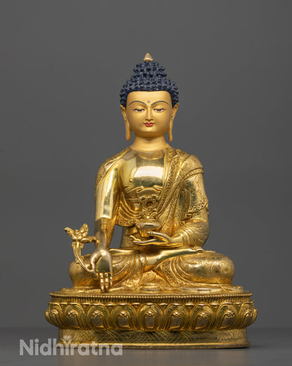 Hand-carved Medicine Buddha Statue seated on a lotus base holding medicine herb