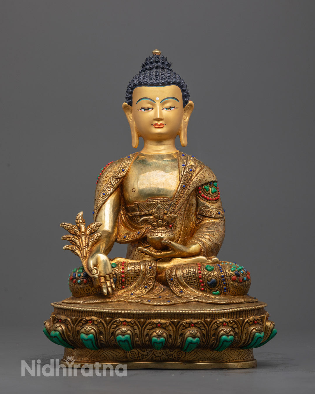 Hand-carved Medicine Buddha statue in meditative posture, adorned with 24k gold