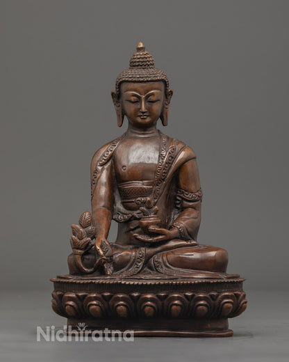 Hand-carved Medicine Buddha statue in oxidized copper with vibrant acrylic colors, seated on a lotus throne with hollow chamber for mantras.