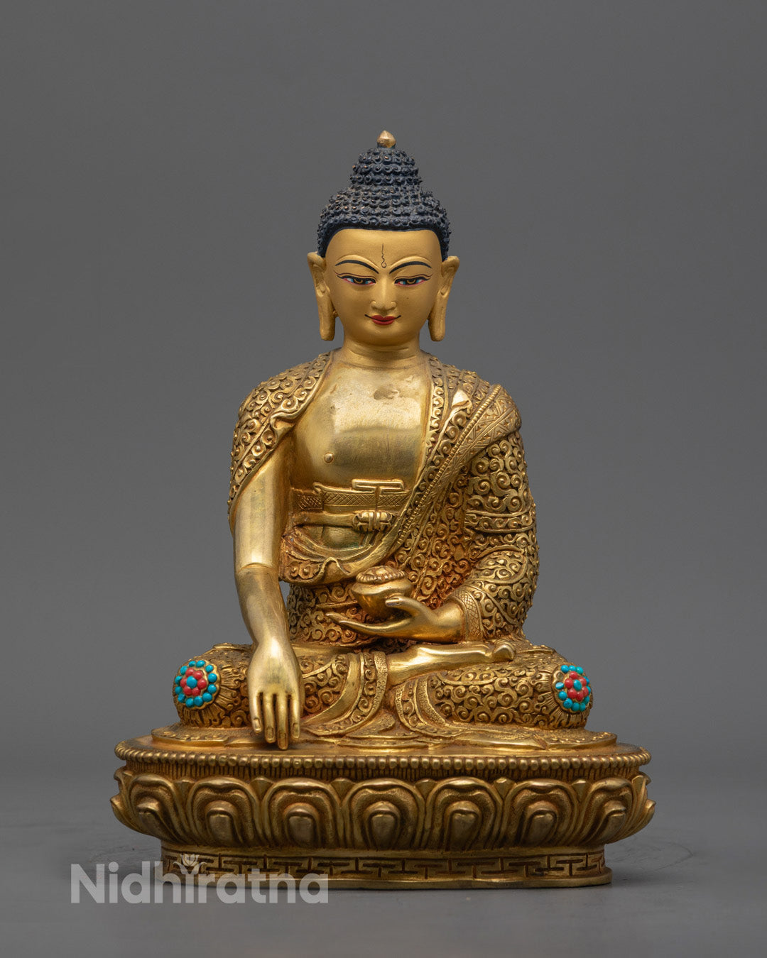 Hand-carved Shakyamuni Buddha statue in Bhumisparsha Mudra, fire-gilded with 24k gold, crafted in Nepal using traditional lost wax method.