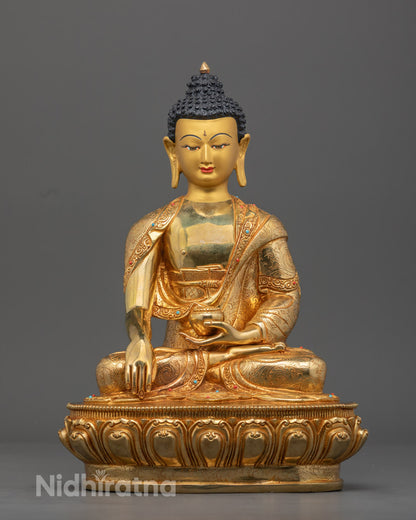 Hand-carved Shakyamuni Buddha statue with 24k gold fire-gilding and semi-precious stones, crafted using the traditional lost wax method in Nepal.