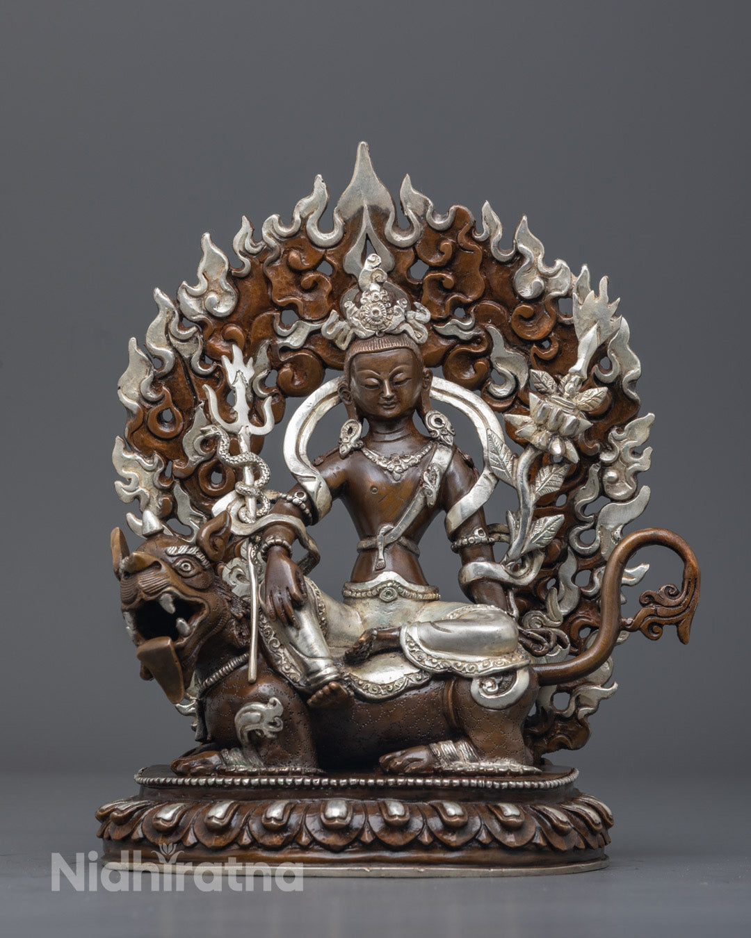 Hand-carved Simhanada Avalokiteshvara statue made of oxidized copper with silver plating and vibrant acrylic colors, crafted by Nepali artisans.