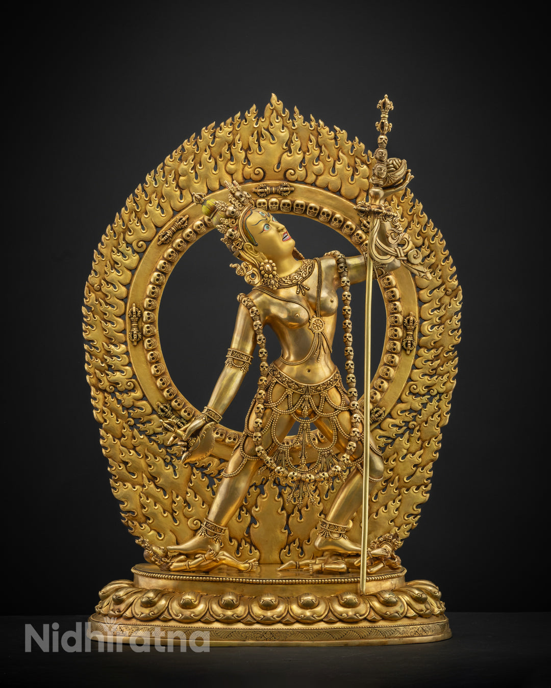 Hand-carved Vajrayogini statue in dynamic posture, crafted in Nepal using the lost wax method with vibrant acrylic colors and 24k gold-plated face.