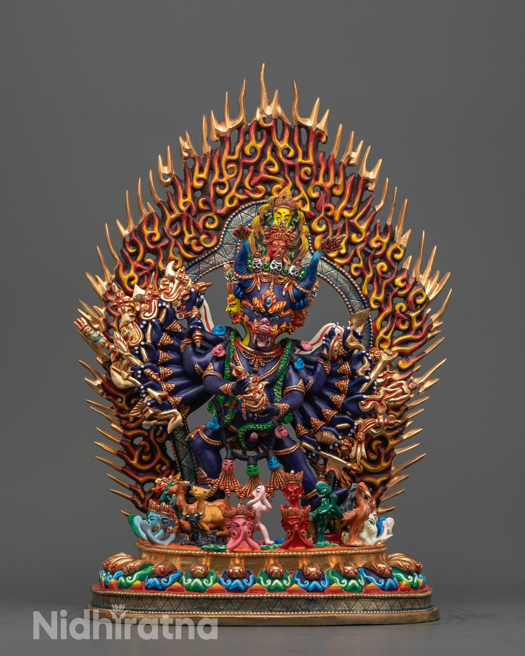 Hand-carved Yamantaka Statue with multiple arms and dark blue acrylic body