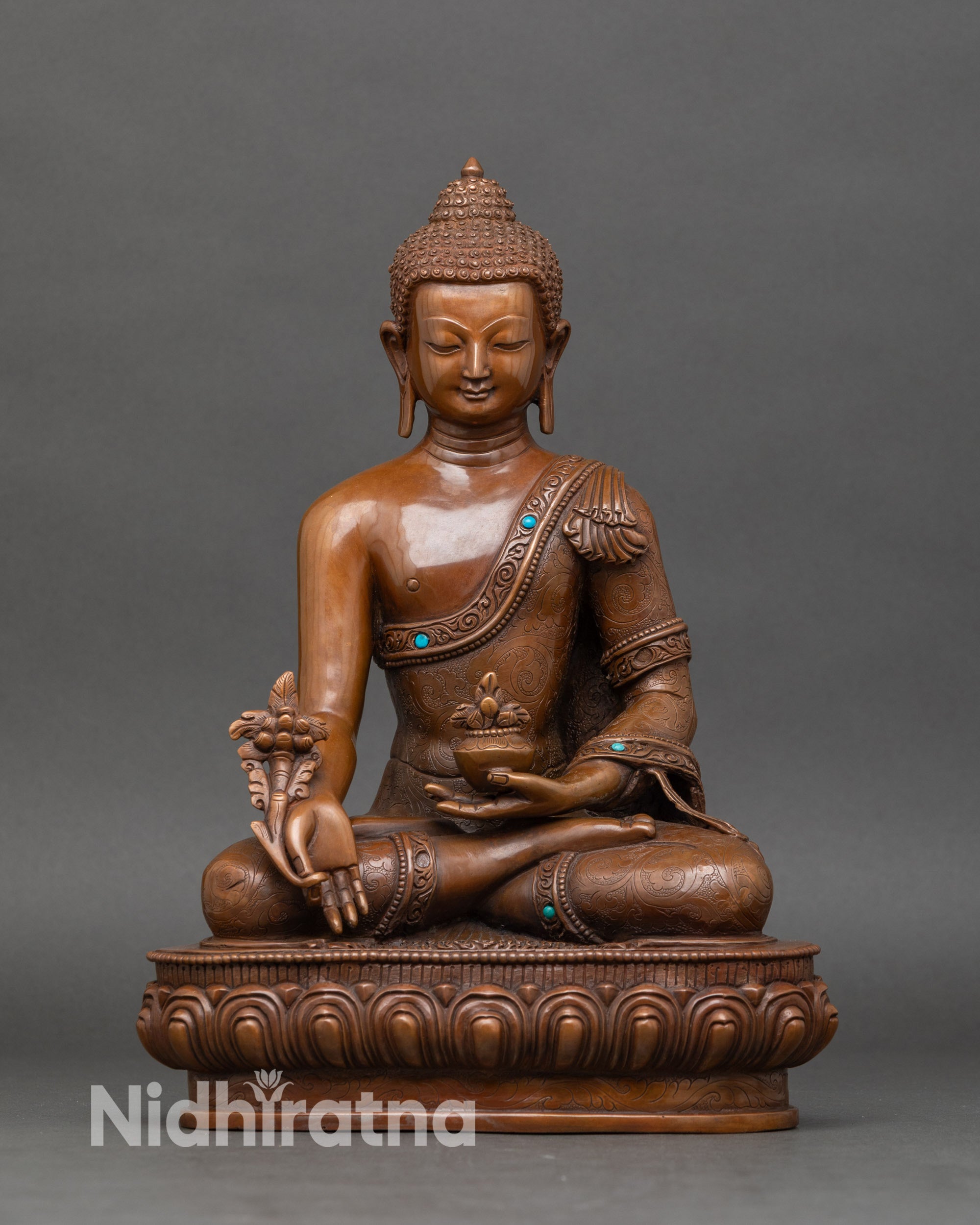 Handcrafted Nepalese Medicine Buddha statue holding myrobalan plant for ultimate healing