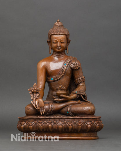 Handcrafted Nepalese Medicine Buddha statue holding myrobalan plant for ultimate healing