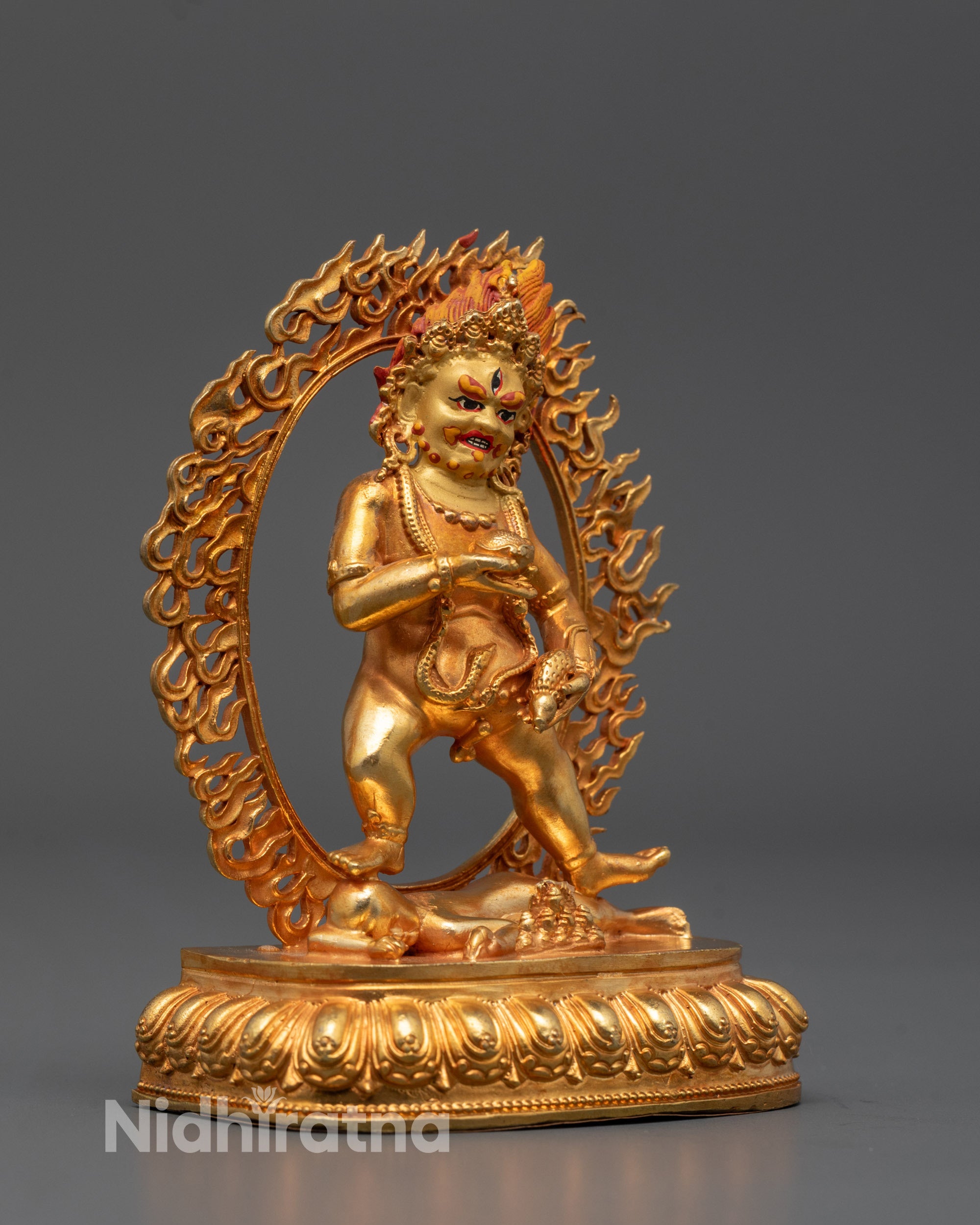Handcrafted Black Dzambhala statue with radiant 24k gold finish, depicting wealth  